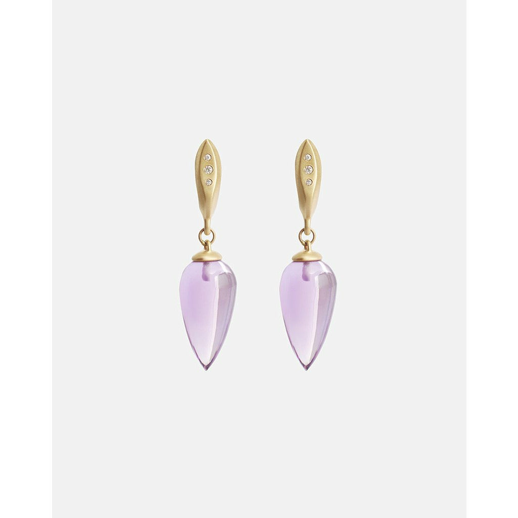 The Amethyst Drops with Diamonds are a Classic earring with a modern touch.  A single polished Amethyst teardrop hangs from a hand formed earring with 3 gorgeous Ethically sourced Diamonds.  Details  19mm Tear shaped Amethysts 6 White Diamonds 0.03ct 14k Yellow Gold Each earring measures 9.3mm width by 37mm length butterfly back