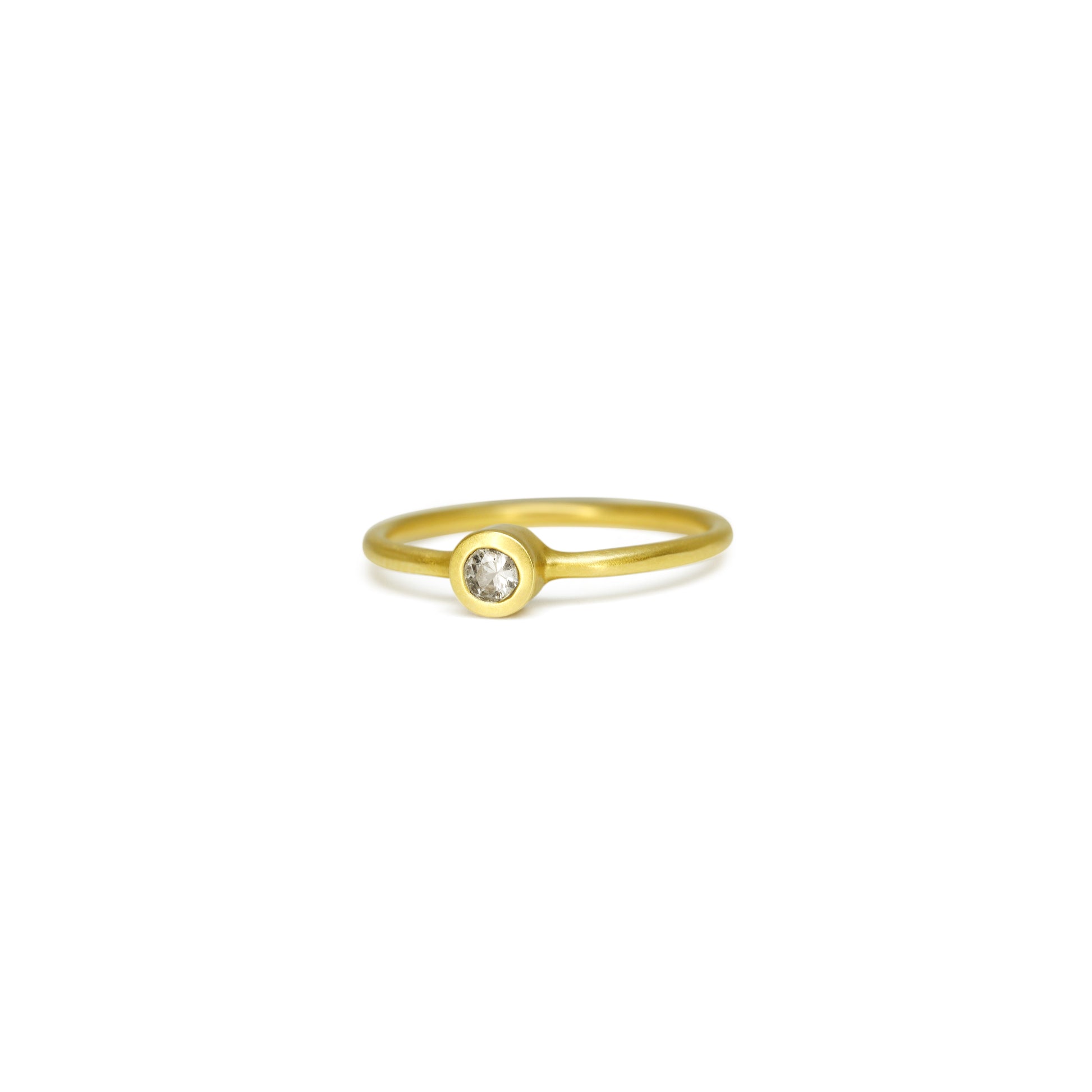 Details  Indulge in the timeless elegance of our Single Diamond Ring. This sparkling centerpiece features exquisite craftsmanship that will captivate your heart and dazzle on your finger. Elevate your style and make a statement with this stunning piece of jewelry.  3mm Round White Diamond Round Band 14k Yellow Gold Satin Finish WxT: 1.45mm