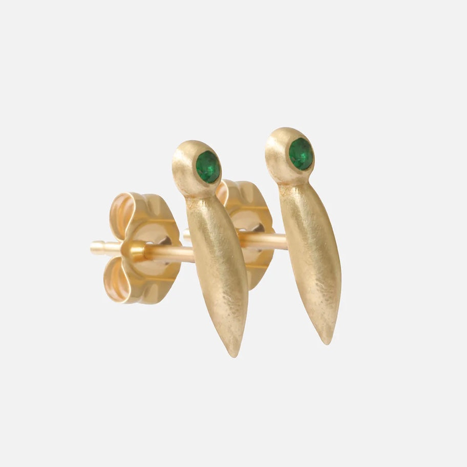 Introducing our stunning Emerald Earrings, featuring a captivating emerald stone in an elegant and timeless design. These versatile Emerald Earrings are perfect for any occasion.  Two 1.5mm Round Emeralds 14k Yellow Gold Satin Finish Each stud measures 10.48mm height by 2.09mm width Sold as a pair