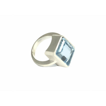 Add a touch of elegance to any outfit with this stunning Bright Blue Topaz Cocktail Ring. The vibrant blue color of the topaz stone is sure to catch everyone's eye, and the elegant cocktail design adds a sophisticated touch. Treat yourself or someone special to this eye-catching ring today!  16mm x 12mm Blue Topaz.