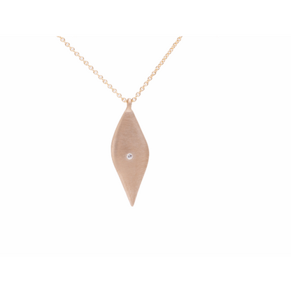 Enhance your jewelry collection with this elegant drop leaf necklace. The versatile design and sparkling diamond accent make it a perfect accessory for any occasion. Add a touch of sophistication to your look with this exquisite piece.