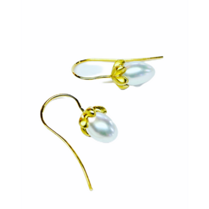 Handmade earring wires to compliment this beautiful classic pearl earrings.  perfect for celebrating special moments and adding glamour to you day.  Details  2 x 5mm Egg Shaped Pearls 14k Yellow Gold Satin Finish Each earring measures 5.9mm width by 10.5mm length