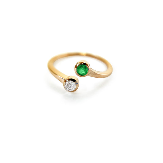 Indulge in the exquisite beauty of this 14K Double Emerald and Diamond Ring. With its elegant design, stunning emerald stones, and sparkling diamond accents, this ring is sure to turn heads and make a statement.  2mm Band that tapers down to the bottom 1.5mm  4mm Diamond   4mm Emerald