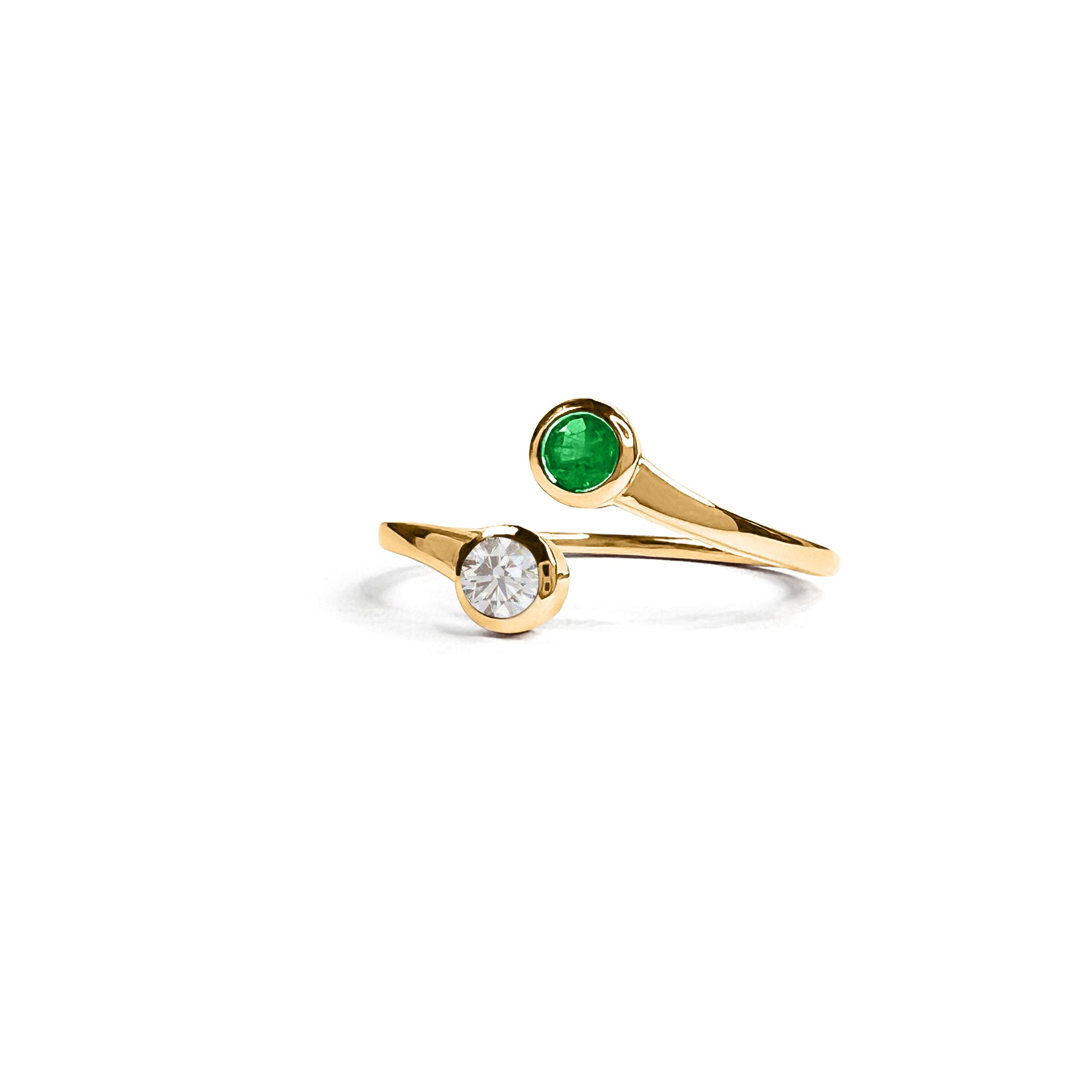 Details.  Indulge in the exquisite beauty of this 14K Double Emerald and Diamond Ring. With its elegant design, stunning emerald stones, and sparkling diamond accents, this ring is sure to turn heads and make a statement.  2mm Band that tapers down to the bottom 1.5mm  4mm Diamond   4mm Emerald