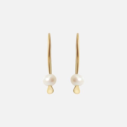 Tiny Pearl Earrings Light as a feather,  featuring a delicate and stylish design that adds a touch of sophistication to any outfit. These exquisite earrings are the perfect accessory for those seeking timeless beauty.  Details  2 x 3mm Pearl Beads 14k Yellow Gold Each earring measures 4.75mm width by 4.1mm length