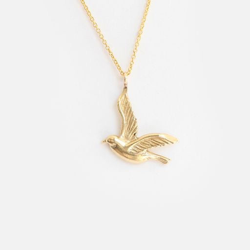 Introducing our elegant BIRD PENDANT, featuring a stunning design that captures the grace and beauty of birds in flight. Details  Carved Gold Bird 16" Chain 14k Yellow Gold Pendant measures 18.3mm x 13.5mm