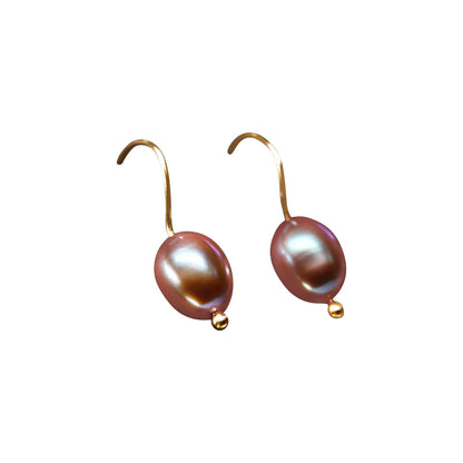 Details.   Indulge in timeless elegance with our 14k Classic Gold Pearl Earrings. Crafted with high-quality Handpicked pearls from Japan, these earrings exude sophistication and grace. 9mm freshwater Pearls.  Color Mauve   HandMade wire. 
