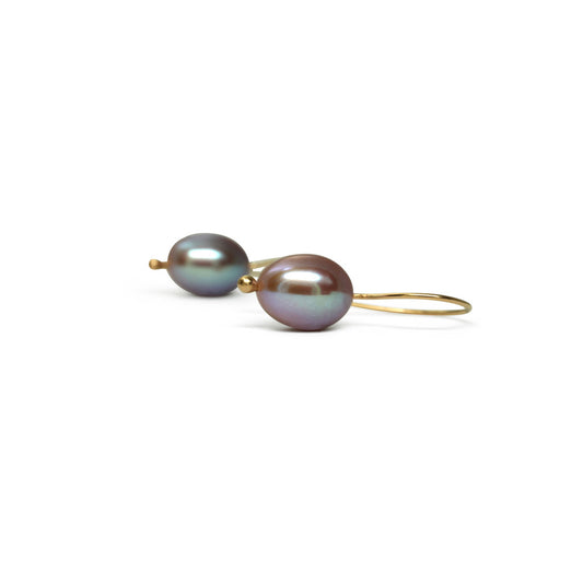 Indulge in timeless elegance with our 14k Classic Gold Pearl Earrings. Crafted with high-quality Handpicked pearls from Japan, these earrings exude sophistication and grace. 9mm freshwater Pearls.  Color Mauve   HandMade wire.   Need different material, stone, finish?
