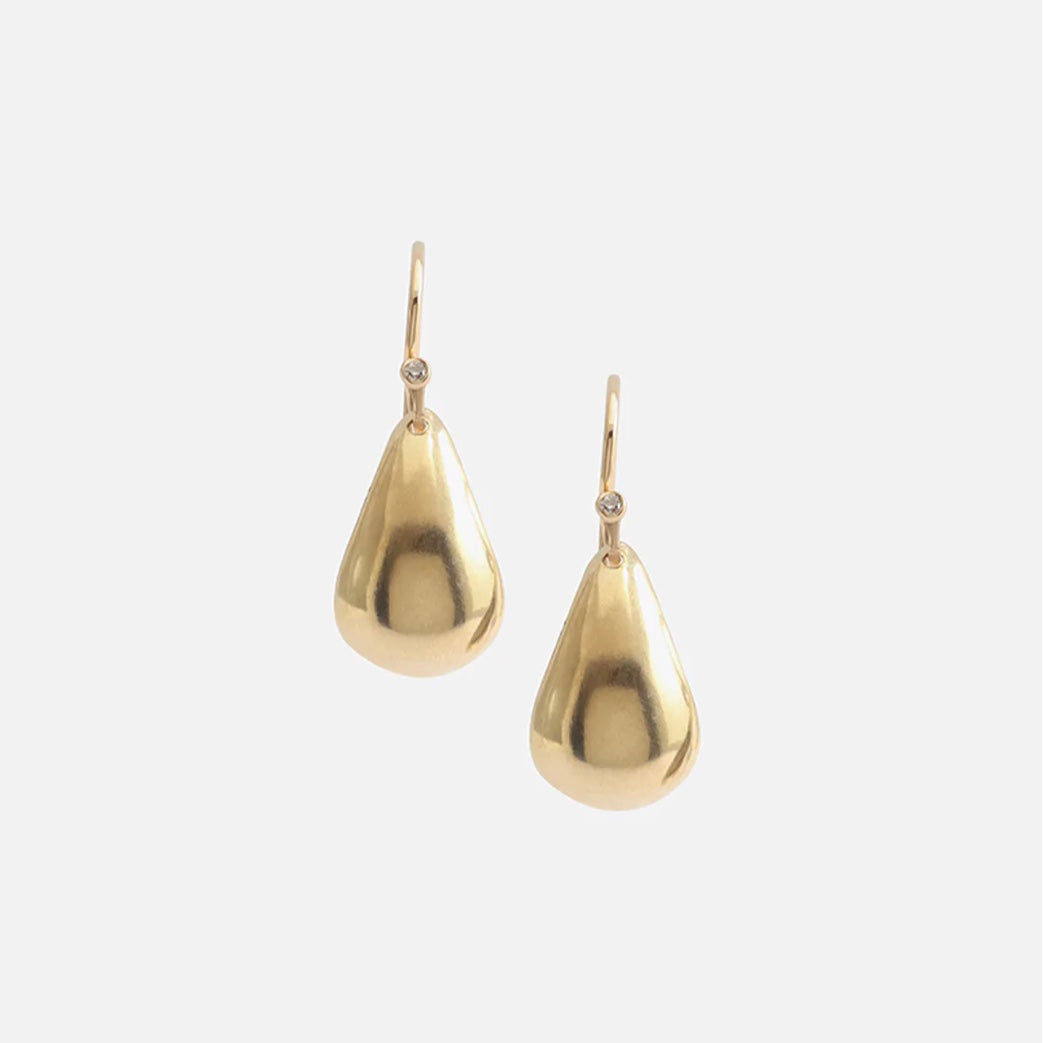 CONCAVE EARRINGS. Their unique design and stylish appeal make them the perfect accessory for any occasion. Add a touch of elegance and sophistication to your look with these must-have earrings.  2 x Round White Diamonds (1 Each) 14k Yellow Gold HxW: 14.7mm x 9.5mm