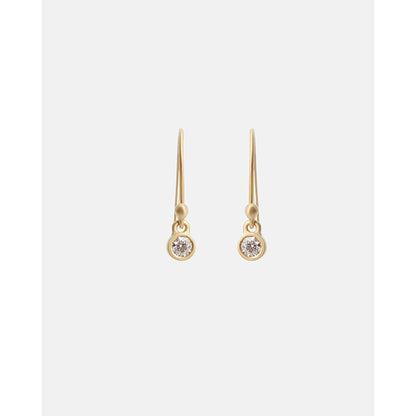 Dainty delicate Diamond drops.  Crafted with sparkling diamonds and featuring a dainty drop design, these earrings are the perfect accessory to add a touch of sophistication to any outfit. Elevate your style and make a statement with our exquisite Diamond Drop Earrings.  Details  2 x 3mm White Diamonds 14k Yellow Gold Satin Finish HxW: 20.05mm x 4.1mm