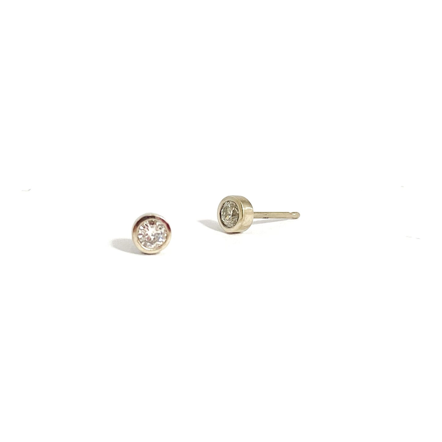 Details.  Indulge in the captivating allure of these 3MM diamond studs. With their sparkling brilliance and timeless elegance, these versatile studs are the perfect accessory to elevate any outfit. Add a touch of luxury to your collection  2 x 3mm Round White Diamond 14k Yellow Gold Each earring measures 4.1mm x 4.15mm butterfly backs Satin Finished or Perfectly polished to a brilliant shine and perfection Beautifully Packaged And Shipped In A Jewelry Gift Box