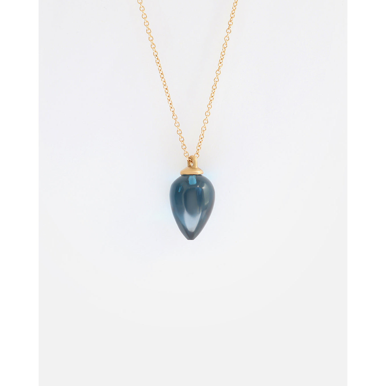 Adorn yourself with the breathtaking beauty of London Blue Topaz. This elegant necklace showcases the stunning blue gemstone w  Pear Shaped Blue Topaz Stone HxW: 13.8mm x 9.05mm 18" Chain 14k Yellow Gold Polished Finish