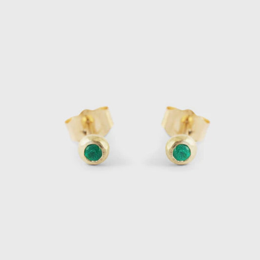 Make a statement with these dainty emerald ball studs. With their timeless elegance and vibrant green hue, they are the perfect accessory to add a touch of sophistication to any outfit Two 1.7mm Emeralds 14k Yellow Gold HxW: 3.48mm x 3.52mm
