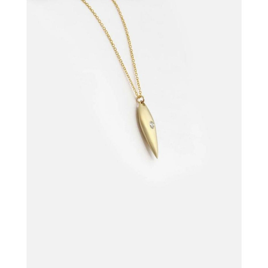 The Leaf with Diamond Pendant showcases a delicate design and a sparkling diamond, making it a versatile accessory that can effortlessly elevate any outfit. Add a touch of elegance and sophistication to your look with this stunning piece of jewelry.  2.25mm Round White Diamonds 14k Yellow Gold Satin Finish HxW: 27.6mm x 6.1mm